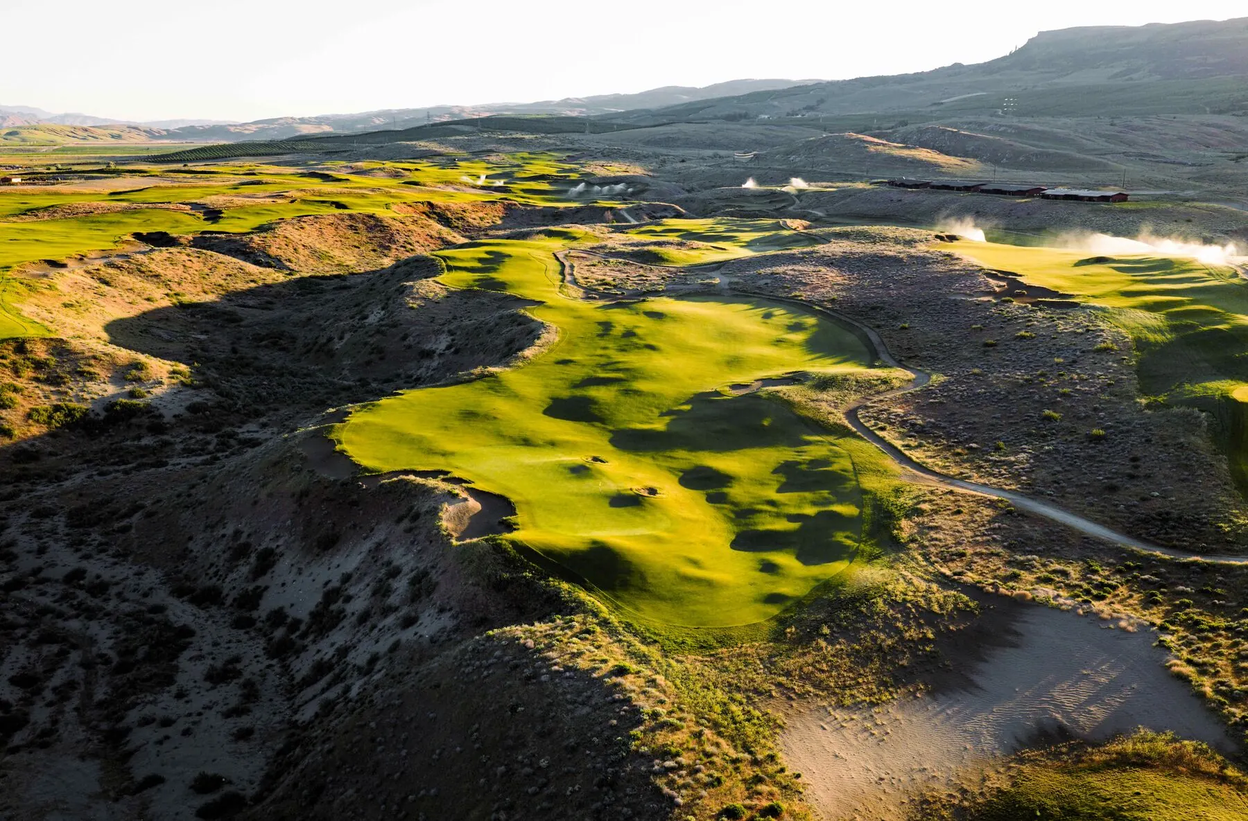 Bunkers and fairway with steam at golden hour