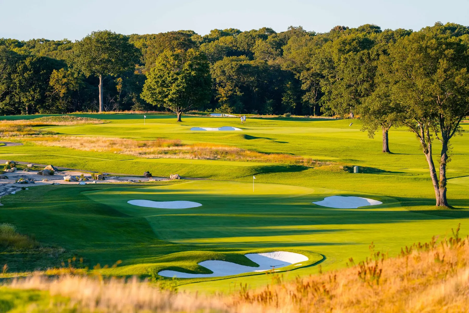 Bunkers and golfers at Huntington Crescent Club