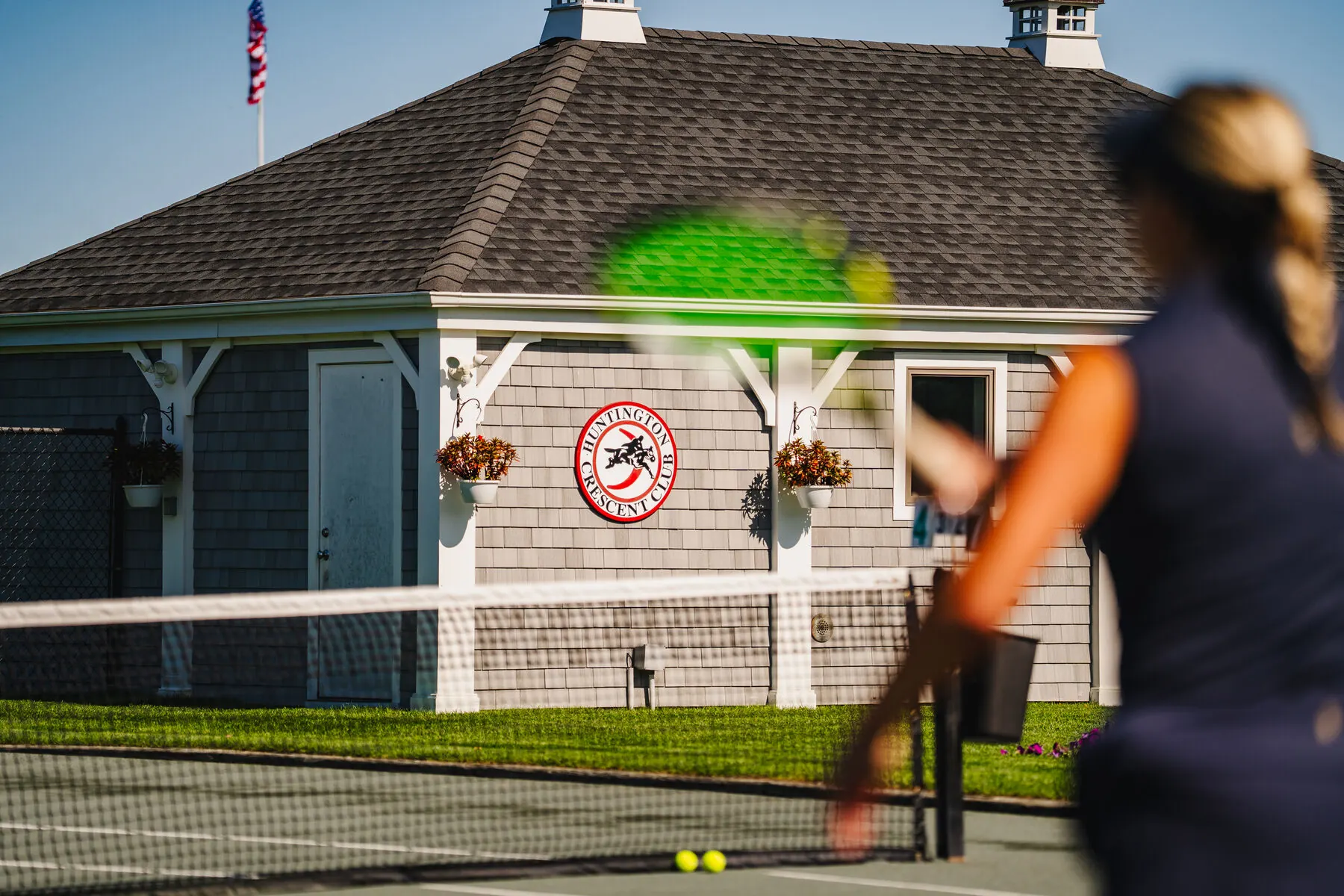 Tennis player serving on the grass court