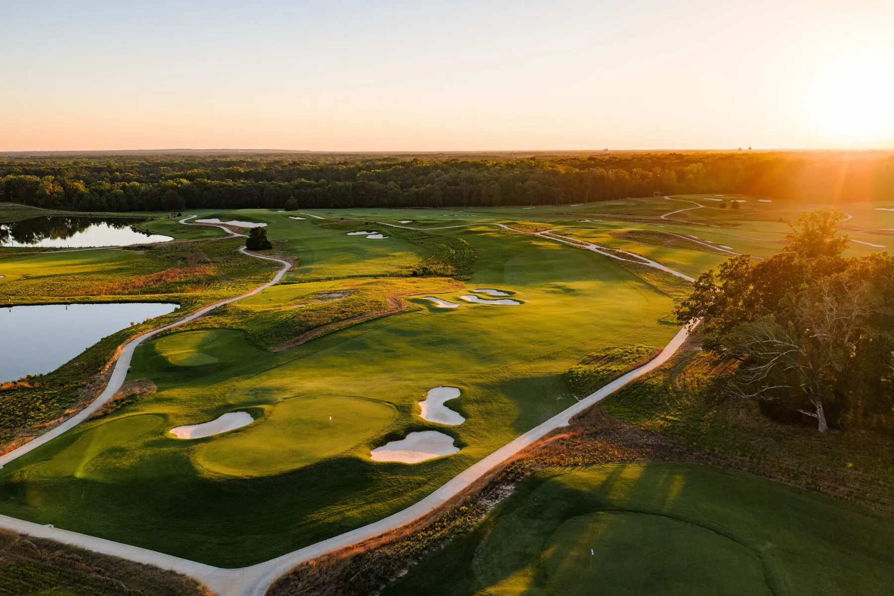 Bunkers and ponds at Mossy Oak at sunset