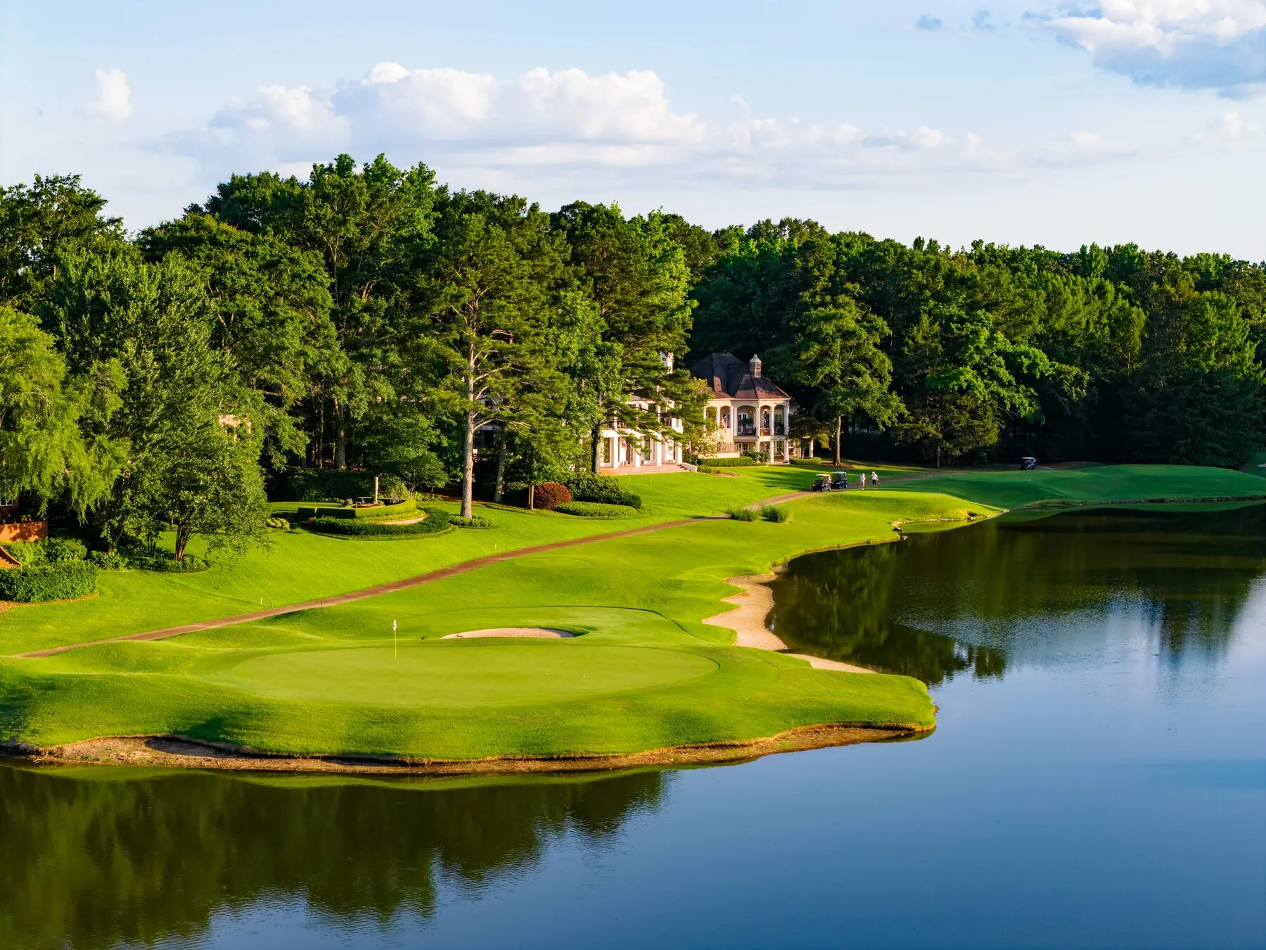 Old Waverly clubhouse and green across the lake