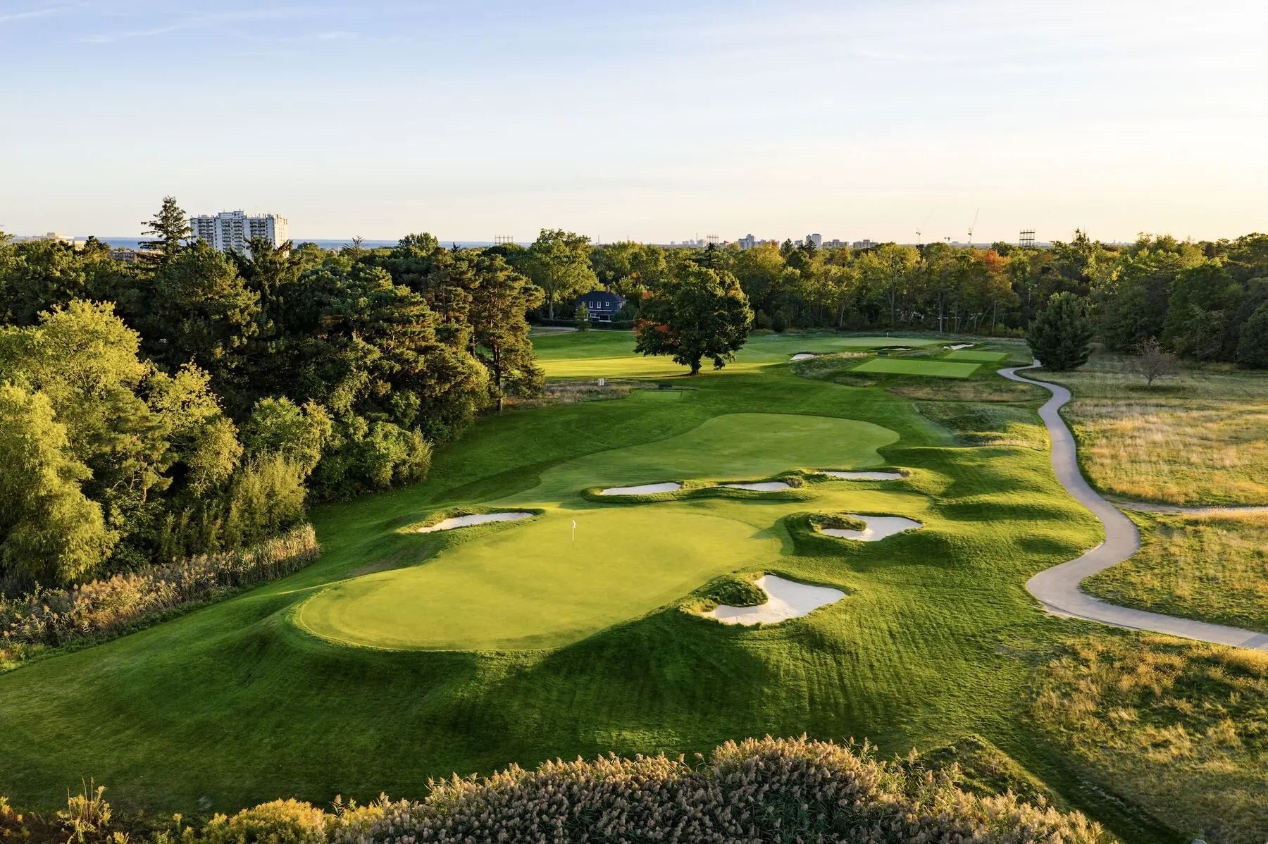 Golfers approaching the green at Toronto Golf Club