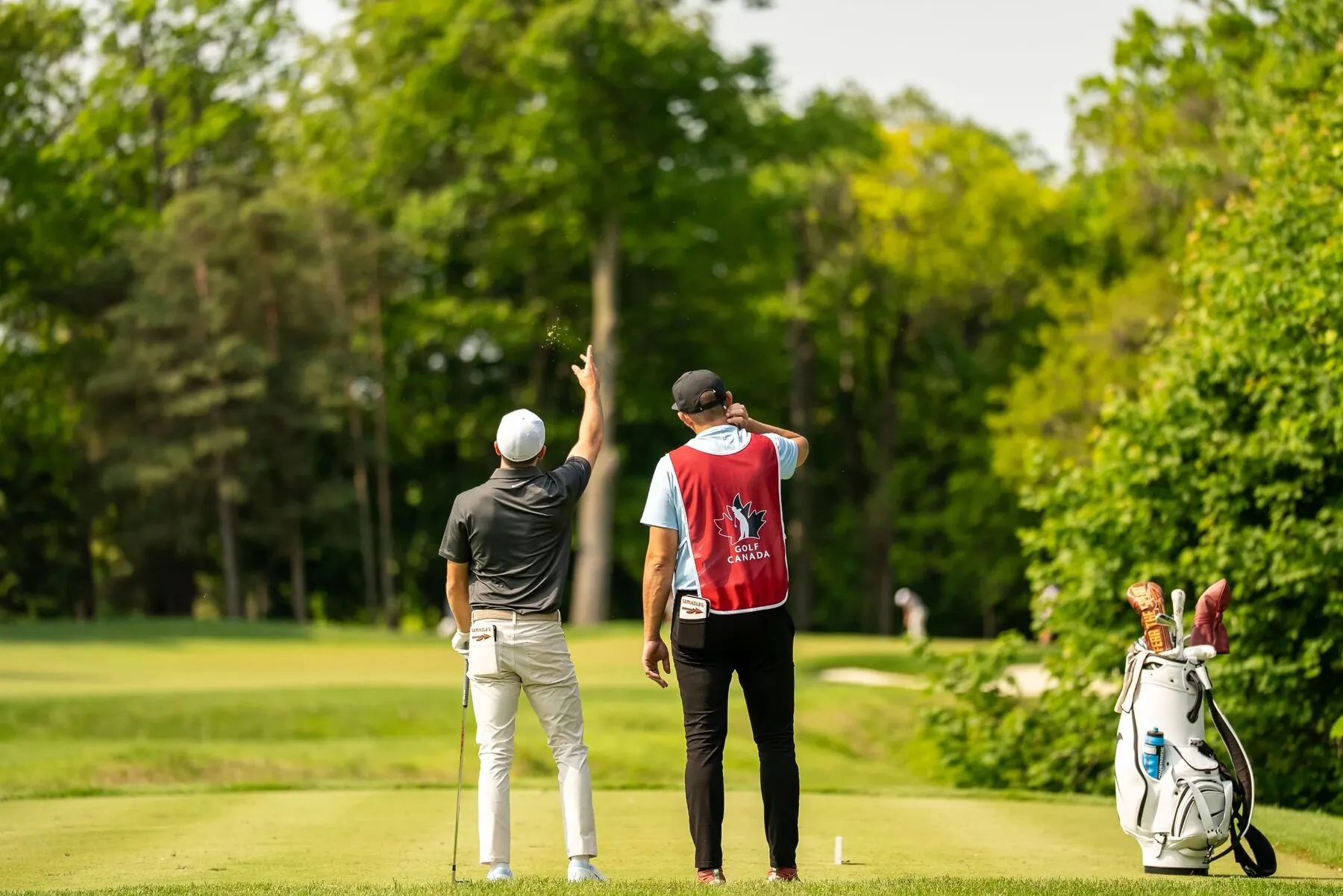 Player and Golf Canada caddie on the tee